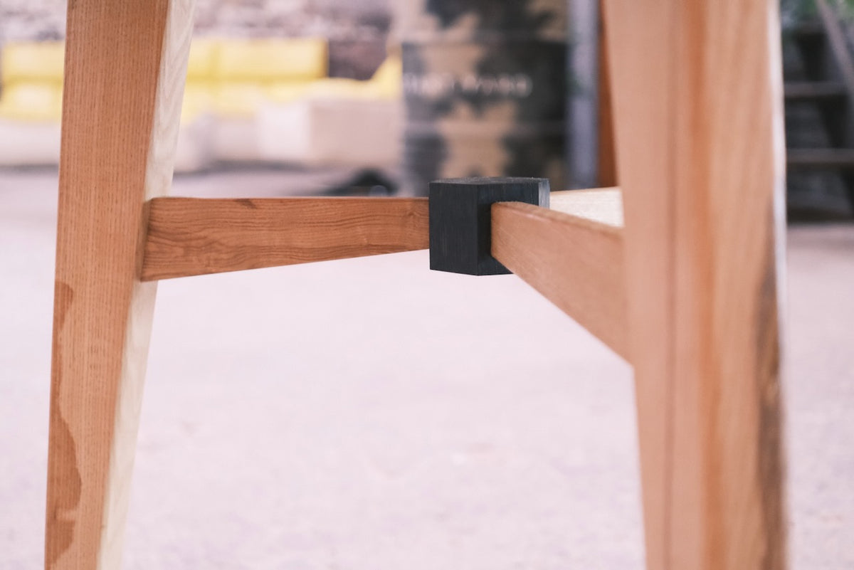 Close-up of a wooden legs showing ebonies oak centre 